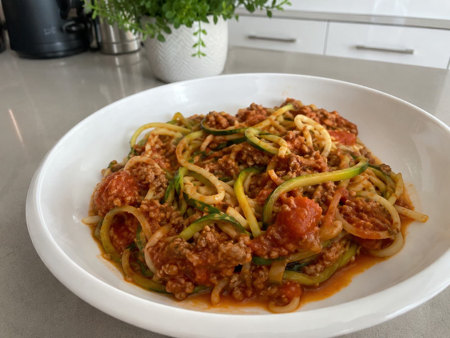 Cucumber noodle pasta with red sauce and meat